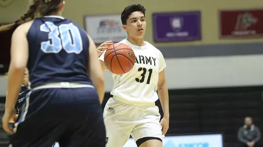 Alisa Fallon dribbles down the court against Connecticut College on Dec. 30, 2018