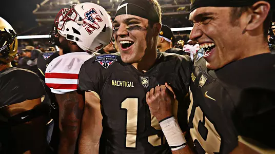 James Nachtigal celebrates Army's bowl win with teammate Nick Schrage.