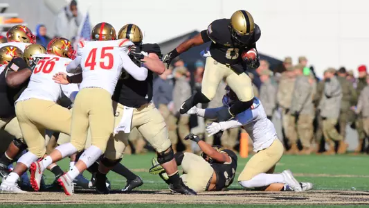 Kelvin Hopkins hurdles defenders
