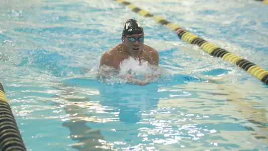 Evan Zhang competes in the breaststroke