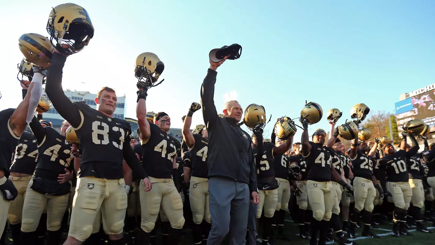 Football celebrates after beating UMass at home