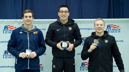 Evan Zhang and Brady Almand pose after finishing inside top-three in 100 breast