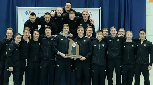 Men's swimming and diving celebrates after taking second at league championships
