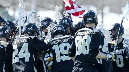 Men's Lacrosse carries flag