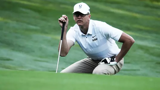 Matt Plunkett lines up a putt at the West Point Golf Course in a match against Navy