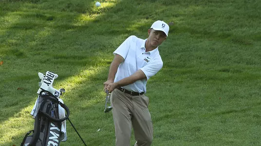 Nick Turner chips the ball onto the green during his four ball match against Navy at the West Point Golf Course in the fall of 2018.