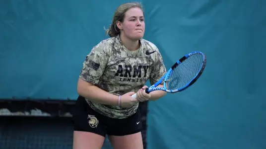 Melanie Allen preparing to return a serve against Quinnipiac