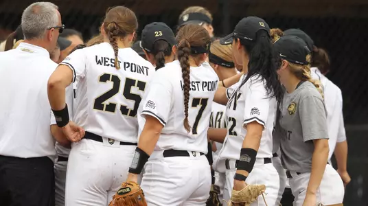 Army softball team huddle