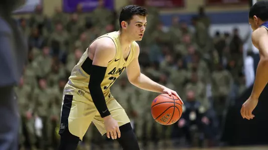 Tommy Funk goes up for a shot on Jordan Cohen of Lehigh