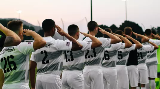 Men's soccer salutes during pregame against Seton Hall