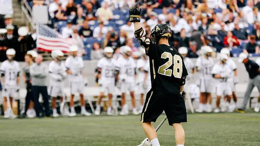 Nate Jones celebrates after scoring a goal at Navy.