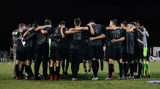 Men's soccer team huddle