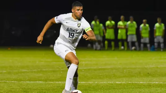 Zac McGraw dribbles down the field