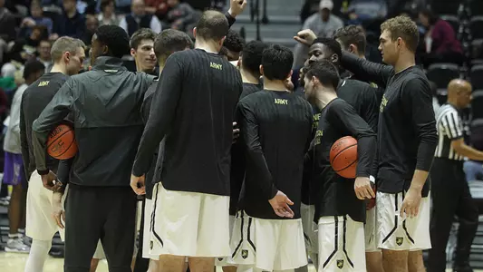 Men's Basketball huddles pregame
