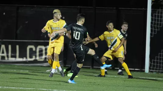 Oscar Pereira shoots at the Siena goal