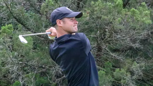Justin Williamson tees off on a par 3 at NCAA Championships at UT Golf Club.