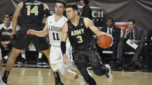 Funk dribbles past Jordan Cohen of Lehigh