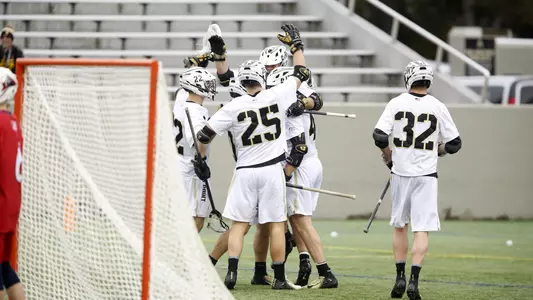 Team celebrating against NJIT 2020