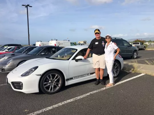 McKinney with wife Pok-hui & 2015 Porsche Cayman.