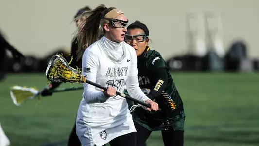 Samantha Stewart runs past Iona defenders