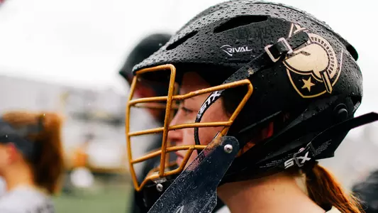 Maddie Burns looks on the field from the sidelines during pregame