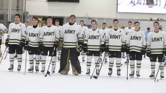 Firsties stand on the ice during the alma mater