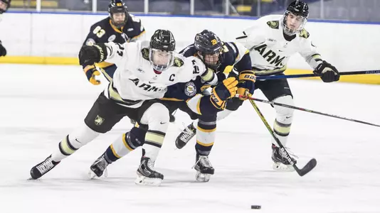 John Zimmerman fights for the puck against Canisius in the Atlantic Hockey Semifinals on March 19, 2021.