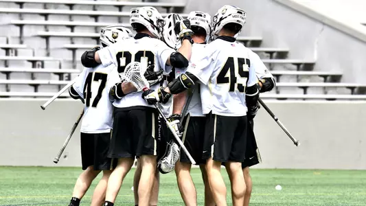 Army men's lacrosse celebrates after scoring against Colgate on April 30, 2021 in a 13-11 win.