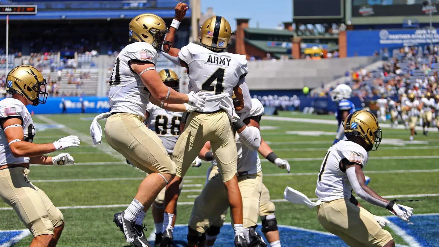 Army Black Knights quarterback Christian Anderson (4) celebrates a touchdown against the Georgia State Panthers during the first half at Center Parc Stadium