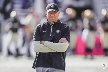 Oct 15, 2022; West Point, New York, USA; Army Black Knights head coach Jeff Monken watches his team warm up before a game against the Colgate Raiders at Michie Stadium. Mandatory Credit: Danny Wild-USA TODAY Sports