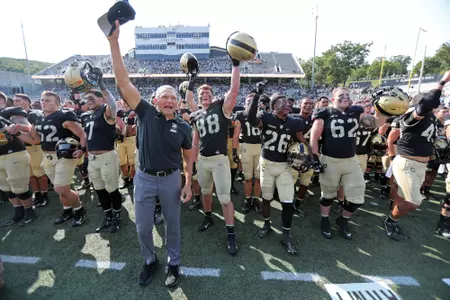 Sep 17, 2022; West Point, New York, USA; Army Black Knights head coach Jeff Monken celebrates with his player after a win against the Villanova Wildcats at Michie Stadium. Mandatory Credit: Danny Wild-USA TODAY Sports