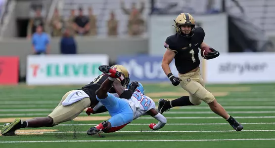 Sep 9, 2023; West Point, New York, USA; Army Black Knights running back Zach Mundell (1) carries the ball against the Delaware State Hornets during the first half at Michie Stadium. Mandatory Credit: Danny Wild-USA TODAY Sports