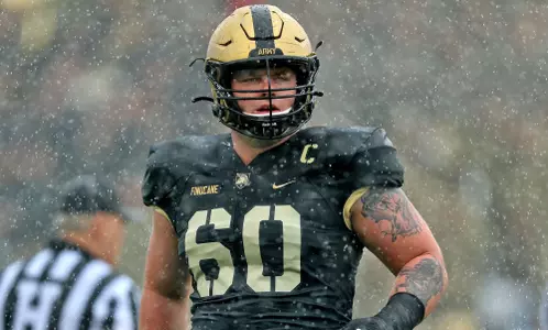 Oct 7, 2023; West Point, New York, USA; Army Black Knights offensive lineman Connor Finucane (60) looks through the raindrops during the first half against the Boston College Eagles at Michie Stadium. Mandatory Credit: Danny Wild-USA TODAY Sports