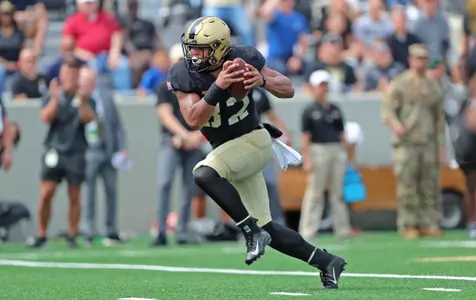 Sep 9, 2023; West Point, New York, USA; Army Black Knights running back Tyson Riley (32) runs in for a touchdown against the Delaware State Hornets during the first half at Michie Stadium. Mandatory Credit: Danny Wild-USA TODAY Sports