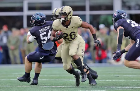Dec 9, 2023; Foxborough, Massachusetts, USA; Army Black Knights running back Kanye Udoh (26) carries the ball against the Navy Midshipmen during the first half of the Army-Navy Game at Gillette Stadium. Mandatory Credit: Danny Wild-USA TODAY Sports