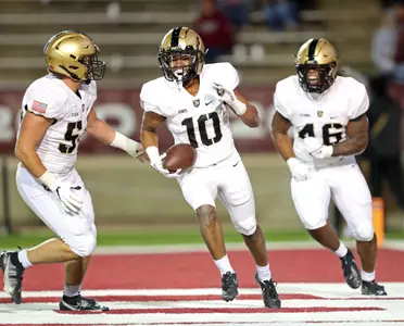 Nov 12, 2022; Troy, Alabama, USA; Army Black Knights defensive back Cameron Jones (10) celebrates after intercepting a pass in the end zone against the Troy Trojans during the second half at Veterans Memorial Stadium. Mandatory Credit: Danny Wild-USA TODAY Sports