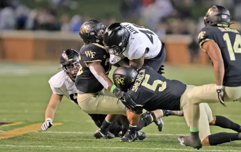 Oct 8, 2022; Winston-Salem, North Carolina, USA; Army Black Knights running back Jarel Dickson (40) barrels into Wake Forest Demon Deacons linebacker Ryan Smenda, Jr. (5)) during the second half at Truist Field. Mandatory Credit: Danny Wild-USA TODAY Sports