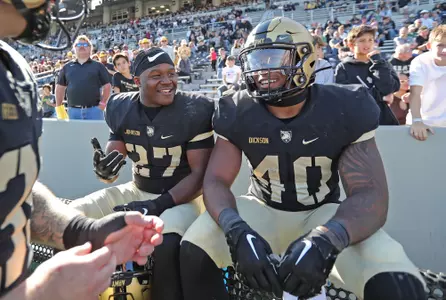 Oct 15, 2022; West Point, New York, USA; Army Black Knights running back Markel Johnson (27) celebrates with running back Jarel Dickson (40) in the final seconds of a 42-17 win against the Colgate Raiders during the second half at Michie Stadium. Mandatory Credit: Danny Wild-USA TODAY Sports