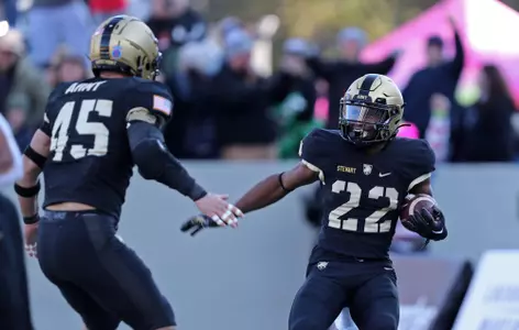 Nov 19, 2022; West Point, New York, USA; Army Black Knights running back Miles Stewart (22) celebrates after receiving a blocked punt for a touchdown against the Connecticut Huskies during the first half at Michie Stadium. Mandatory Credit: Danny Wild-USA TODAY Sports