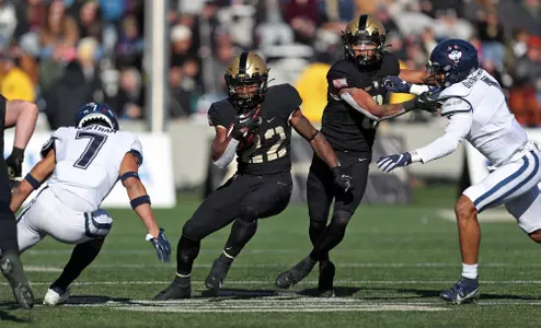 Nov 19, 2022; West Point, New York, USA; Army Black Knights running back Miles Stewart (22) carries the ball against the Connecticut Huskies during the first half at Michie Stadium. Mandatory Credit: Danny Wild-USA TODAY Sports