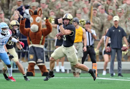 Sep 9, 2023; West Point, New York, USA; Army Black Knights quarterback Bryson Daily (13) runs in for a touchdown against the Delaware State Hornets during the first half at Michie Stadium. Mandatory Credit: Danny Wild-USA TODAY Sports