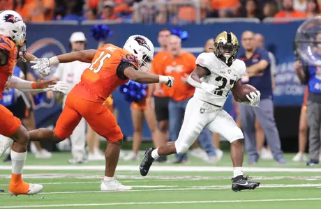 Sep 15, 2023; San Antonio, Texas, USA; Army Black Knights running back Markel Johnson (27) runs with the ball in front of UTSA Roadrunners linebacker Avery Morris (25)during the first half at the Alamodome. Mandatory Credit: Danny Wild-USA TODAY Sports