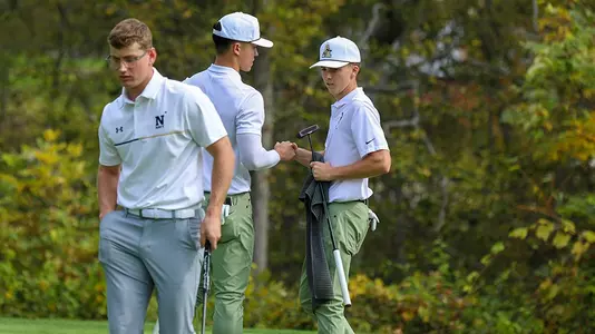 Heckel Jr. and Jeffords handshake vs. Navy after Jeffords sinking a putt