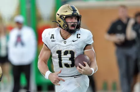 Nov 9, 2024; Denton, Texas, USA; Army Black Knights quarterback Bryson Daily (13) celebrates after scoring his second touchdown against the North Texas Mean Green during the second half at DATCU Stadium. Mandatory Credit: Danny Wild-Imagn Images