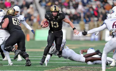 Nov 30, 2024; West Point, New York, USA; Army Black Knights quarterback Bryson Daily (13) carries the ball against the UTSA Roadrunners during the first half at Michie Stadium. Mandatory Credit: Danny Wild-Imagn Images