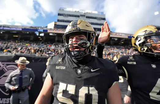 Nov 30, 2024; West Point, New York, USA; Army Black Knights offensive lineman Braden Bartosh (50) screams on the sidelines during the first half against the UTSA Roadrunners at Michie Stadium. Mandatory Credit: Danny Wild-Imagn Images
