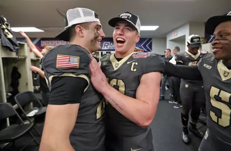 Dec 28, 2024; Shreveport, LA, USA; Army Black Knights quarterback Bryson Daily (13) and the Army Black Knights celebrate a 27-6 win against the Louisiana Tech Bulldogs to capture the 2024 Radiance Technologies Independence Bowl at Independence Stadium. Mandatory Credit: Danny Wild-Imagn Images