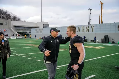 Jeff Monken hugs QB Bryson Daily after win over UTSA (Nov. 30, 2024)