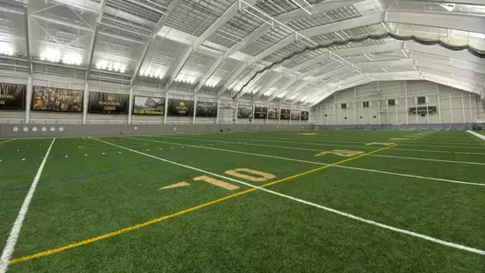 Foley Athletic Center with the turf and roof