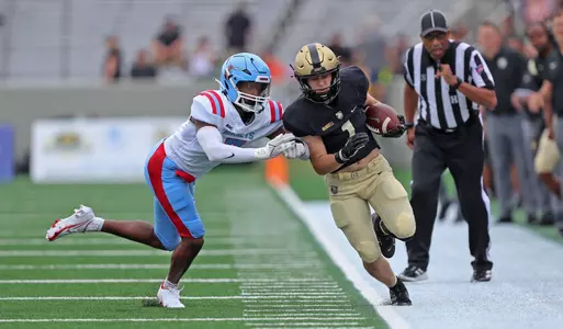 Sep 9, 2023; West Point, New York, USA; Army Black Knights running back Zach Mundell (1) carries the ball against the Delaware State Hornets during the first half at Michie Stadium. Mandatory Credit: Danny Wild-USA TODAY Sports